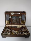 An oak part canteen of cutlery