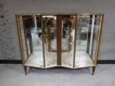 A mid 20th century melamine display cabinet