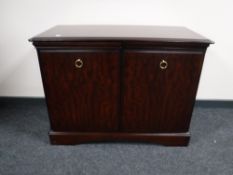 A Stag Minstrel cocktail cabinet in a mahogany finish