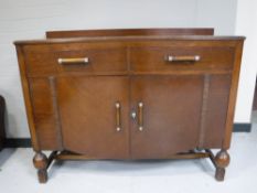 A mid 20th century oak sideboard