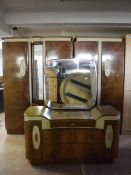 A three piece mid twentieth century walnut bedroom suite