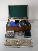 An inlaid wooden table box containing a collection of vintage embroidered handkerchiefs,