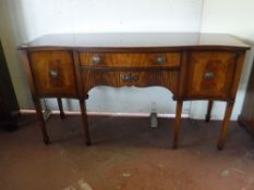 An inlaid mahogany serpentine fronted Regency style sideboard