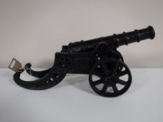 A cast metal miniature cannon