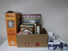 A boxed Nova electric heater, two boxes of nursery pictures, jigsaws, mugs, folding stool,
