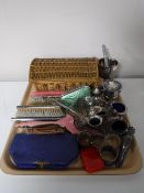 A tray of plated ware, cased sewing kit, wicker sewing basket,