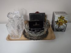A tray containing a boxed Dartington glass vase, glass duck ornaments, decanters,