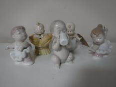 Five Nao figures including three babies,