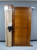 A contemporary 6' bed frame in a walnut finish,