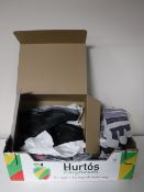 A box containing two pairs of work boots,
