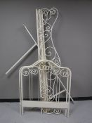 A white metal day bed