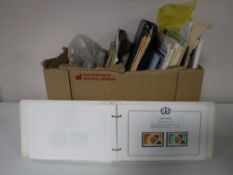 A box containing a quantity of assorted stamp albums and loose stamps (various)