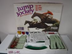 A boxed vintage jump jockey electric steeple chasing game