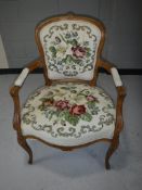 A carved walnut framed armchair