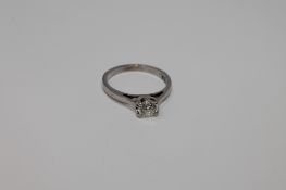 An 18ct white gold diamond solitaire ring,