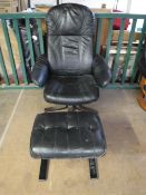 A black leather swivel armchair with similar stool