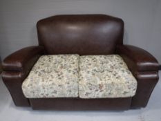 A 20th century three piece lounge suite in brown vinyl