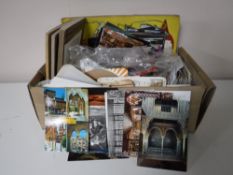 A box containing a large quantity of postcards,
