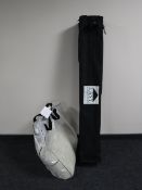 A gazebo in carry bag with cover