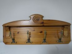 A pine wall mounted coat rack