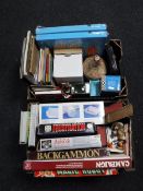 Two boxes of board games, books, Hummel figures, candles, photographic splicer,