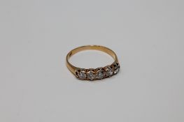 An 18ct gold five stone diamond ring