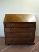 A late 19th century mahogany bureau on bracket feet