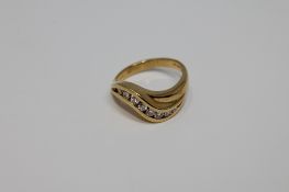 An 18ct gold eight stone diamond ring, 5.