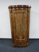 A late nineteenth century mahogany corner cupboard,