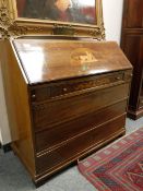 A continental inlaid mahogany bureau,