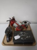 A tray of three vintage oil cans, two car head lamps,