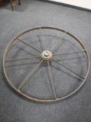 A large wrought iron cart wheel