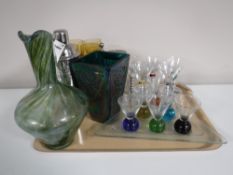 A tray containing assorted glassware, including a lidded beer stein, wine glasses,