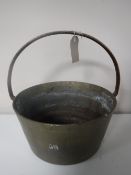 A brass jam pan