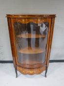 A reproduction inlaid mahogany corner cupboard with gilt-metal mounts