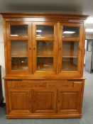 A Barker and Stonehouse contemporary triple door glazed bookcase,
