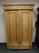 A continental pine double door wardrobe,