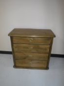 A pine four drawer chest