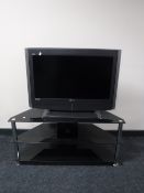 A Grundig 32 inch LCD TV on stand