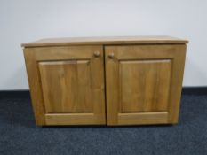 An elmwood double door cabinet CONDITION REPORT: This measures 55cm high by 92cm