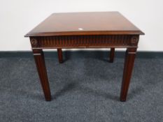 A reproduction inlaid mahogany lamp table