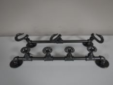 Two cast metal coat racks