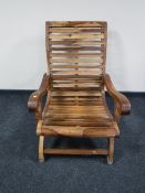 A teak garden armchair