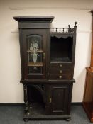 A late nineteenth century arts and crafts style side cabinet,