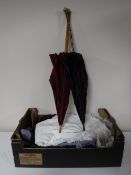 A box of vintage clothing and two parasols CONDITION REPORT: The clothing would
