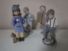 Three Nao figures of boys together with a Nao figure of a girl (4)