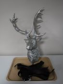 A tray of three leather belts together with a silvered stags head