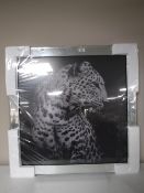 A contemporary all glass mirror together with an all glass framed print of a cheetah