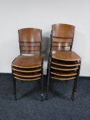 A set of nine mid twentieth century teak metal framed stacking chairs