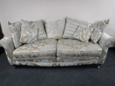 A contemporary scroll arm settee,